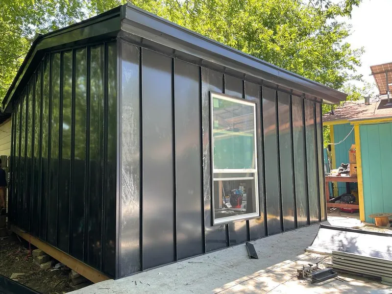 Black standing seam metal wall panels for Roof Inspection in Chippewa Falls
